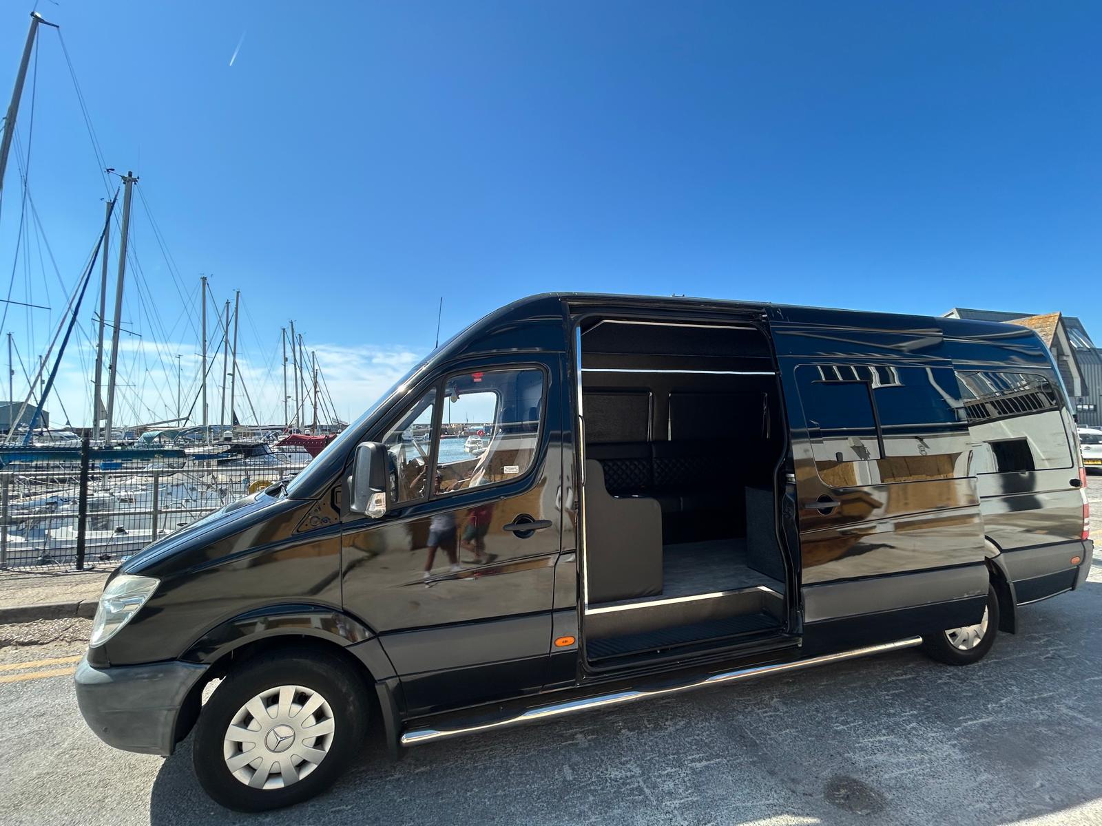The Ryels luxury party bus with guests arriving on Brighton seafront
